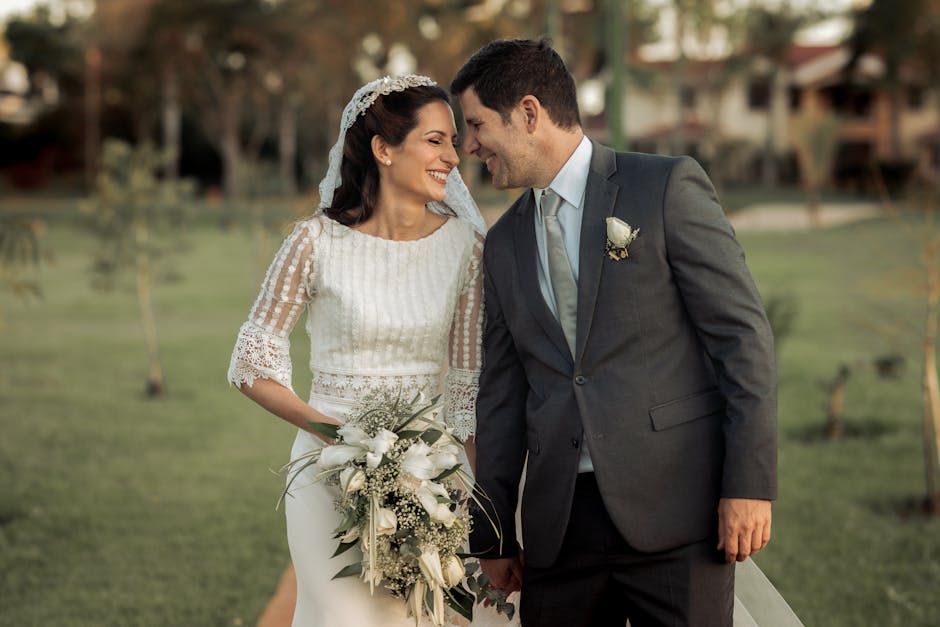 Happy couple enjoying a tender moment during their beautiful outdoor wedding ceremony.