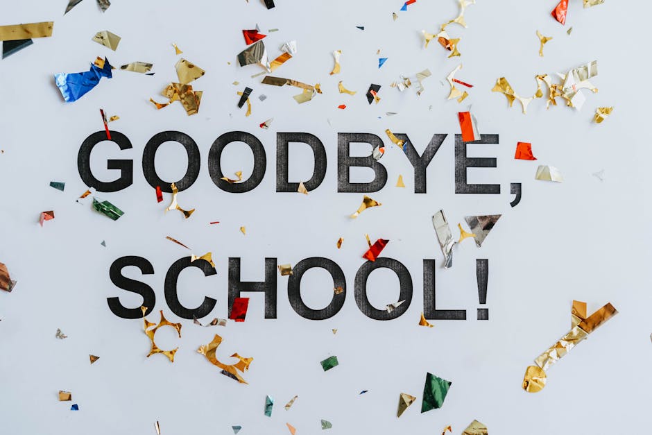 Colorful confetti surrounds a goodbye school message, celebrating graduation.
