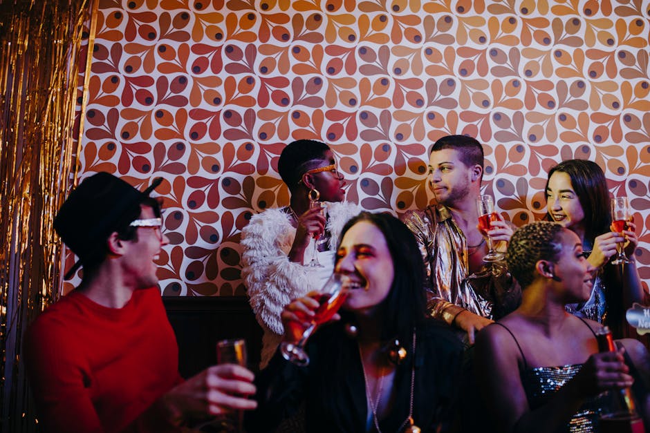 A diverse group of friends enjoying a vibrant New Year's Eve celebration indoors.