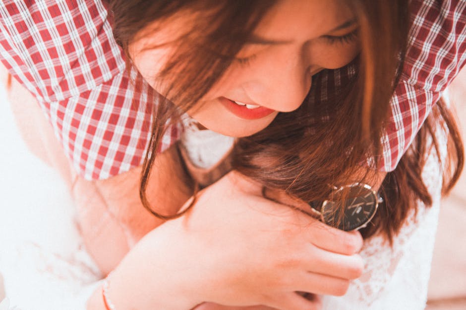 Capturing a joyful moment of an Asian woman being embraced, showcasing happiness and affection.