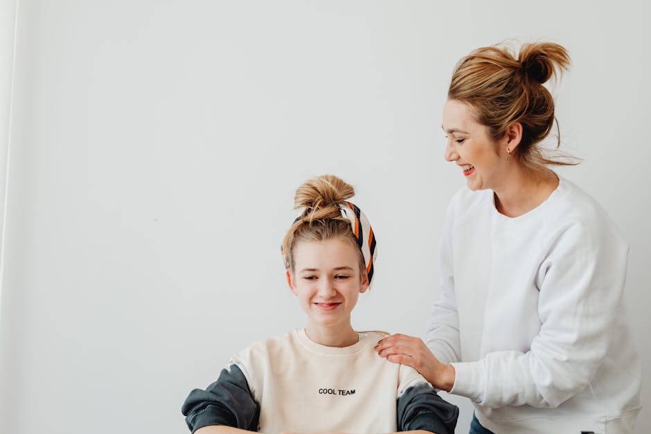 A joyful mother and daughter bonding indoors, sharing smiles and laughter.
