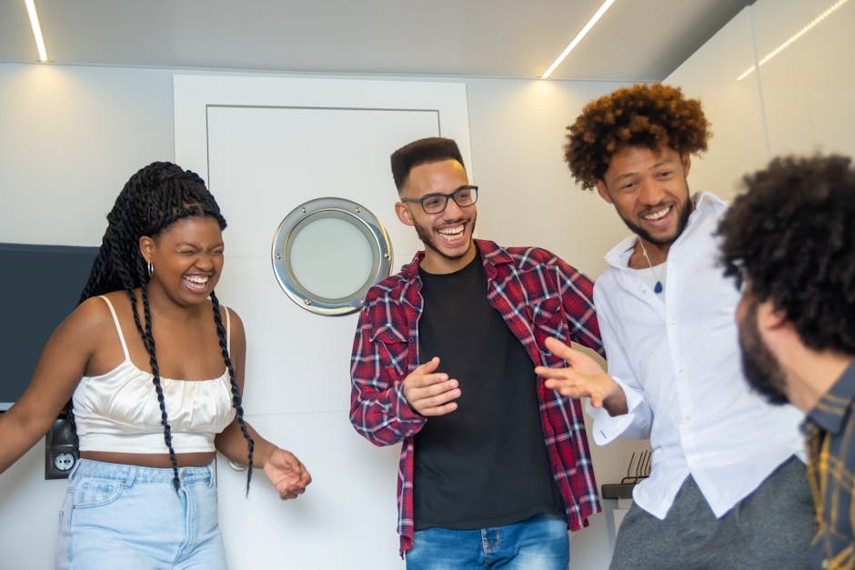 Group of friends sharing laughter indoors, capturing joyful moments and camaraderie.